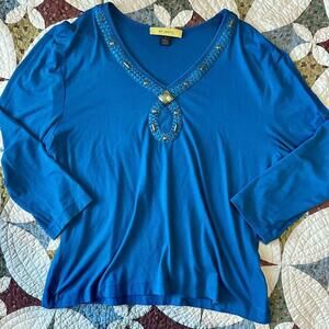 St John blue quarter sleeve blouse with gold accents.